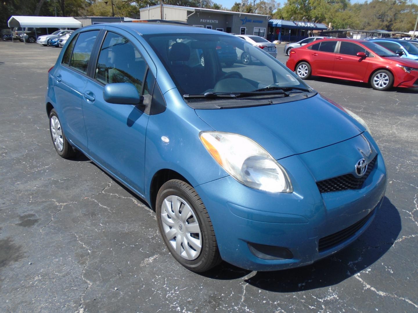 2010 BLUE /Grey Toyota Yaris Liftback 5-Door AT (JTDKT4K39A5) with an 1.5L L4 DOHC 16V engine, 4-Speed Automatic transmission, located at 6112 N Florida Avenue, Tampa, FL, 33604, (888) 521-5131, 27.954929, -82.459534 - Photo#2